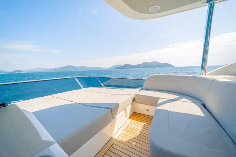  Yacht Photos Pics Luxurious 2022 Absolute 56 FLY yacht with spacious deck and stunning ocean view.