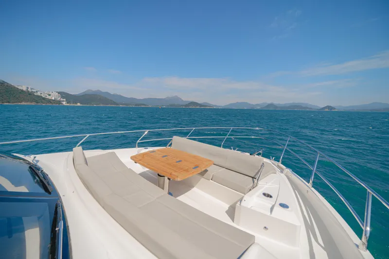  Yacht Photos Pics Luxury Absolute 56 FLY yacht deck with seating, ocean view, 2022 model.