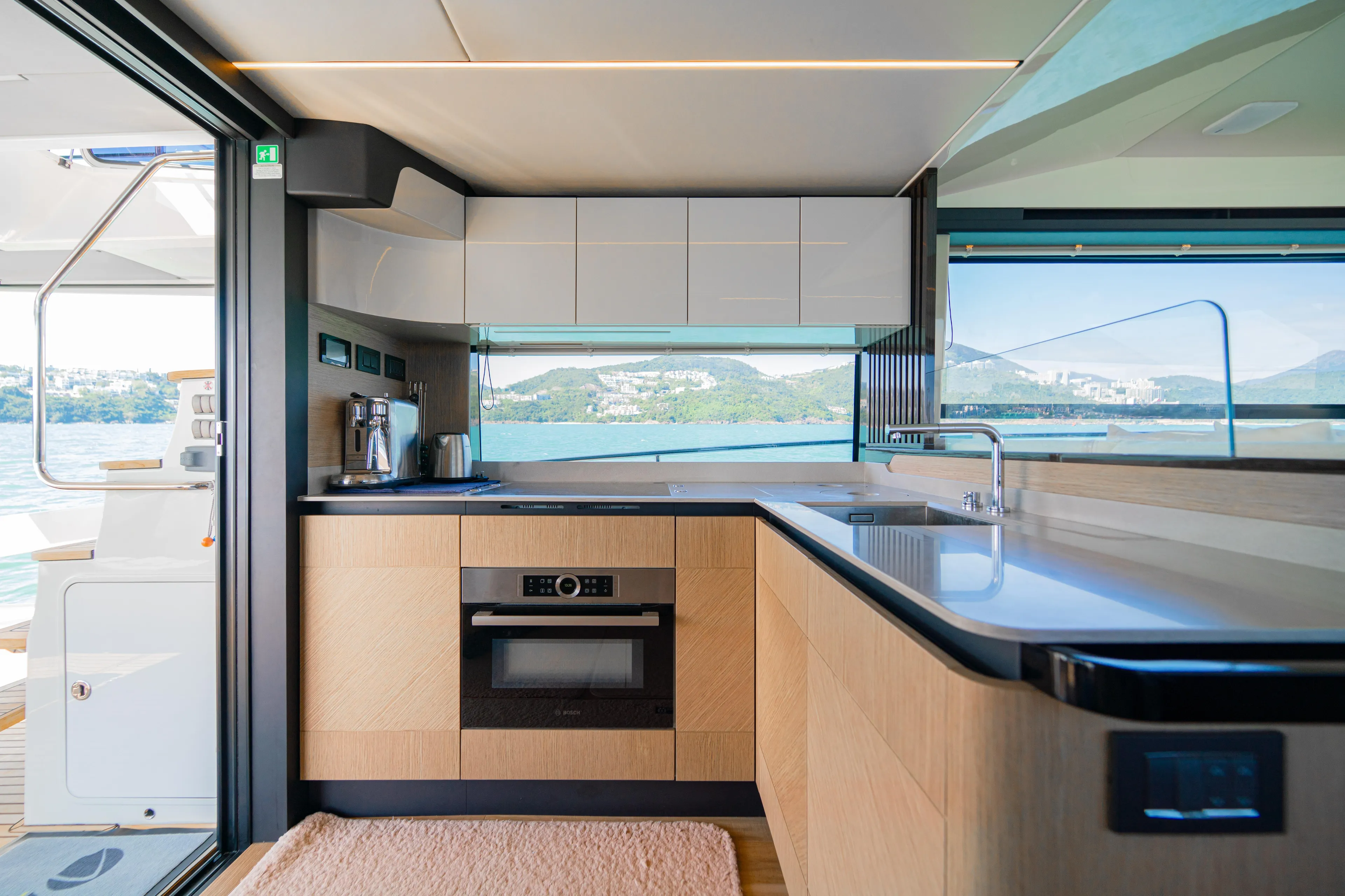  Yacht Photos Pics Modern kitchen interior on 2022 Absolute 56 FLY yacht with scenic ocean view.