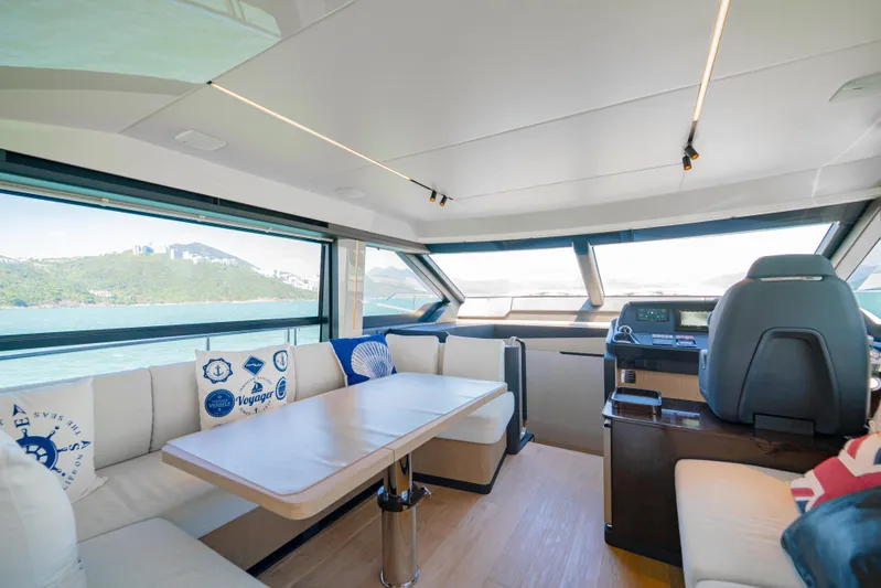  Yacht Photos Pics Luxurious interior of 2022 Absolute 56 FLY yacht with panoramic windows and modern seating.