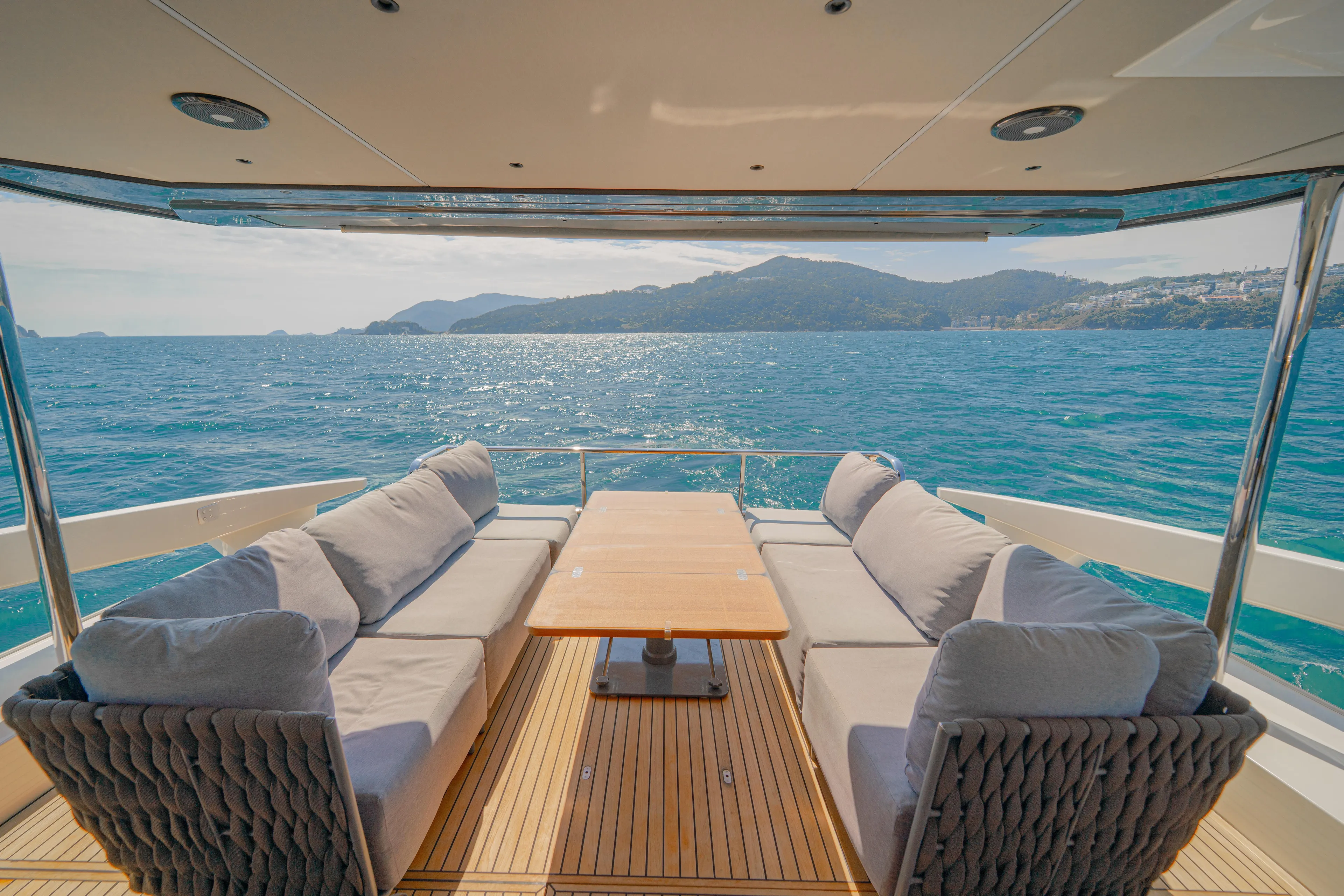  Yacht Photos Pics Luxurious 2022 Absolute 56 FLY yacht deck with ocean view and comfortable seating.
