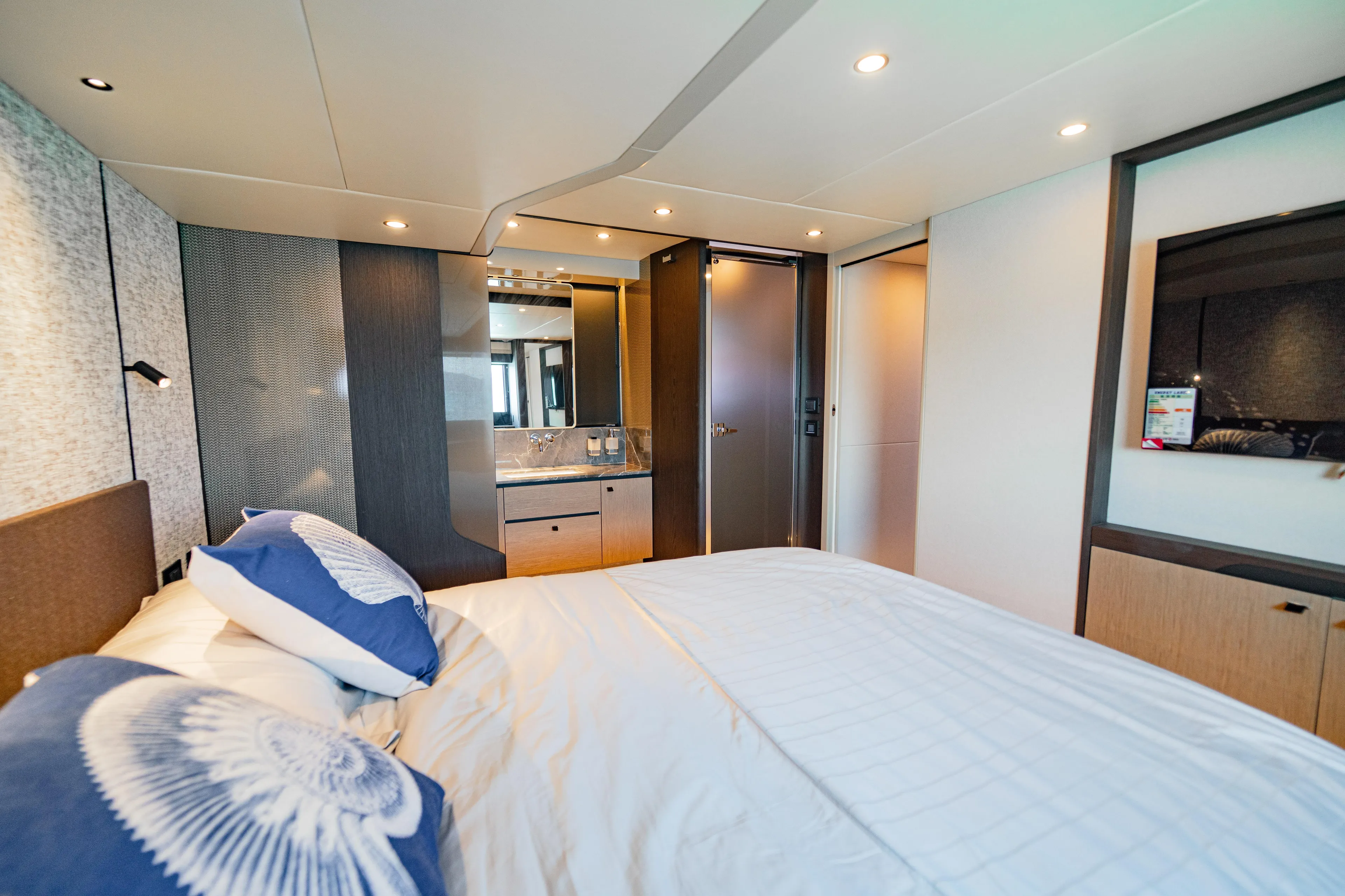  Yacht Photos Pics Luxurious bedroom interior of 2022 Absolute 56 FLY yacht with modern design.
