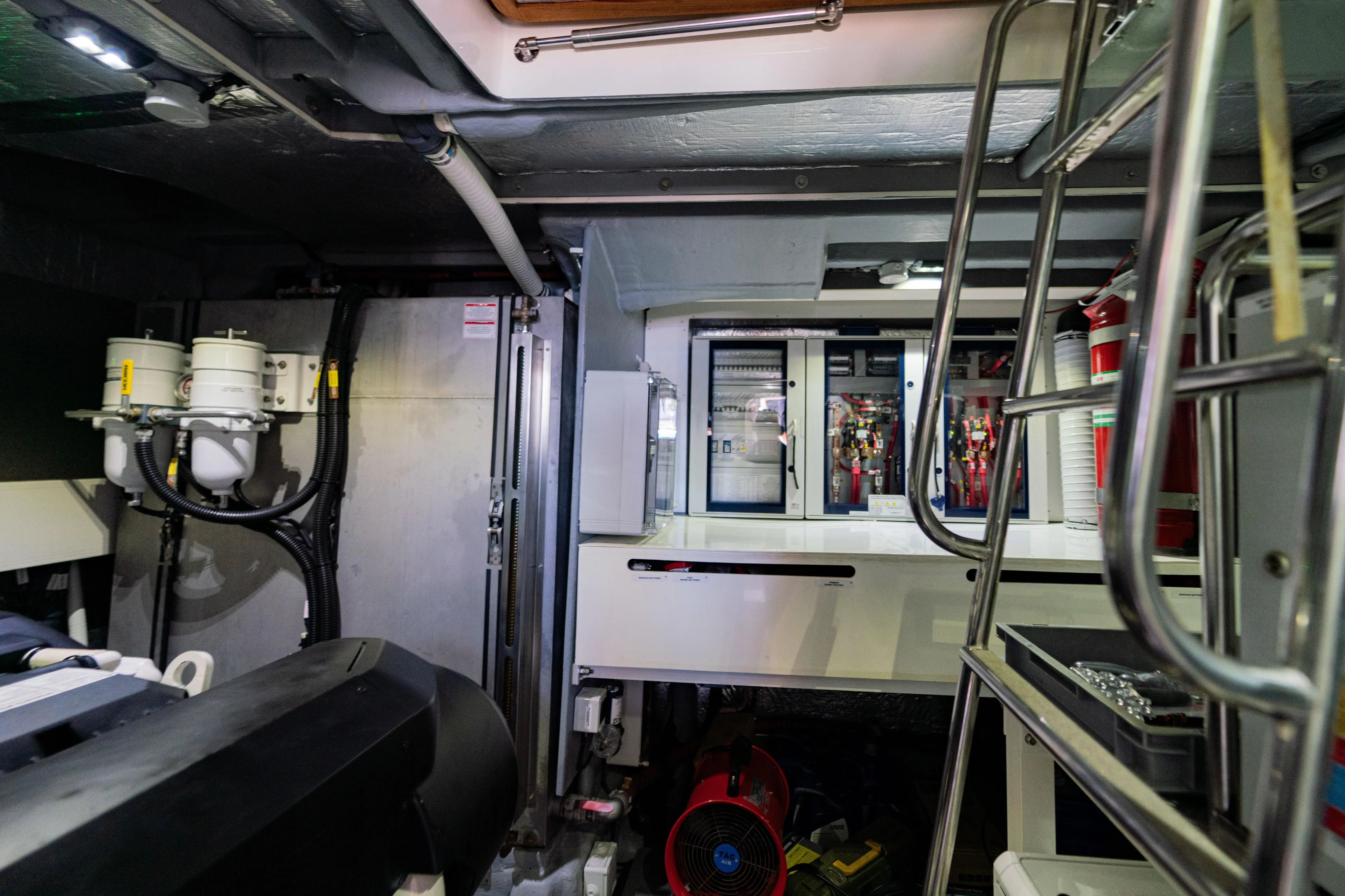  Yacht Photos Pics Engine room of 2022 Absolute 56 FLY yacht with equipment and ladder.