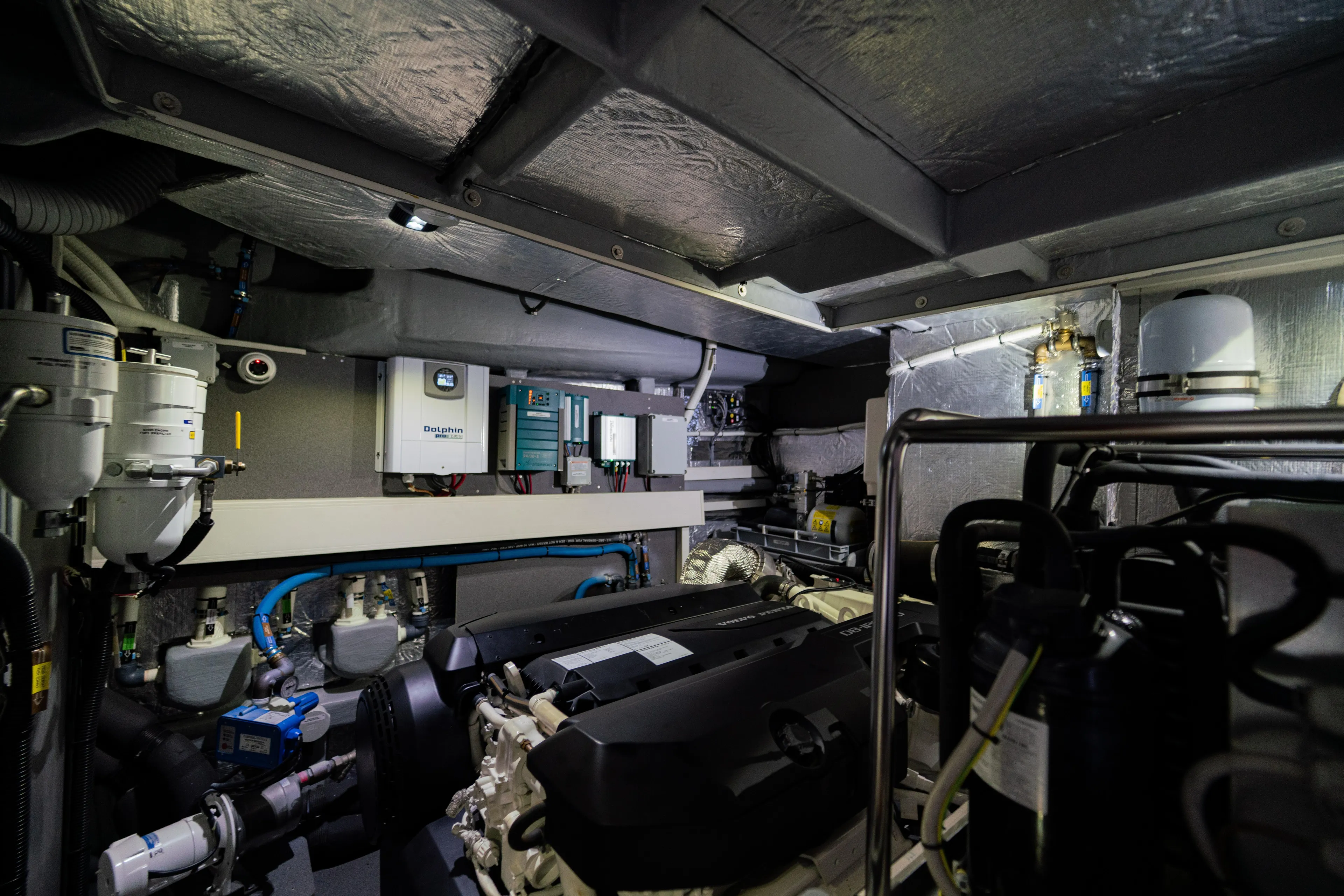  Yacht Photos Pics Engine room of 2022 Absolute 56 FLY yacht, showcasing advanced machinery and equipment.