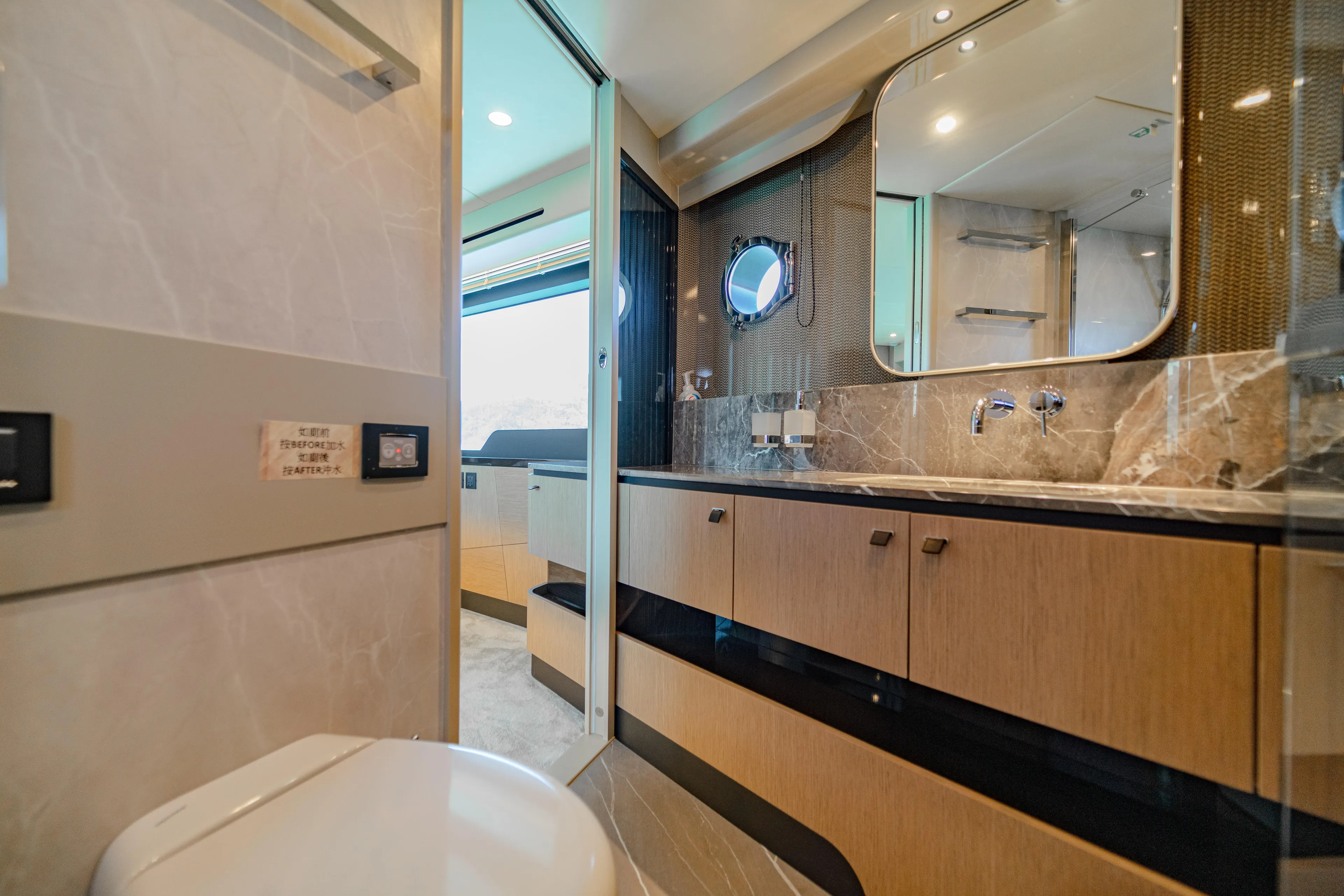  Yacht Photos Pics Luxurious bathroom interior of 2022 Absolute 56 FLY yacht with modern fixtures and elegant design.