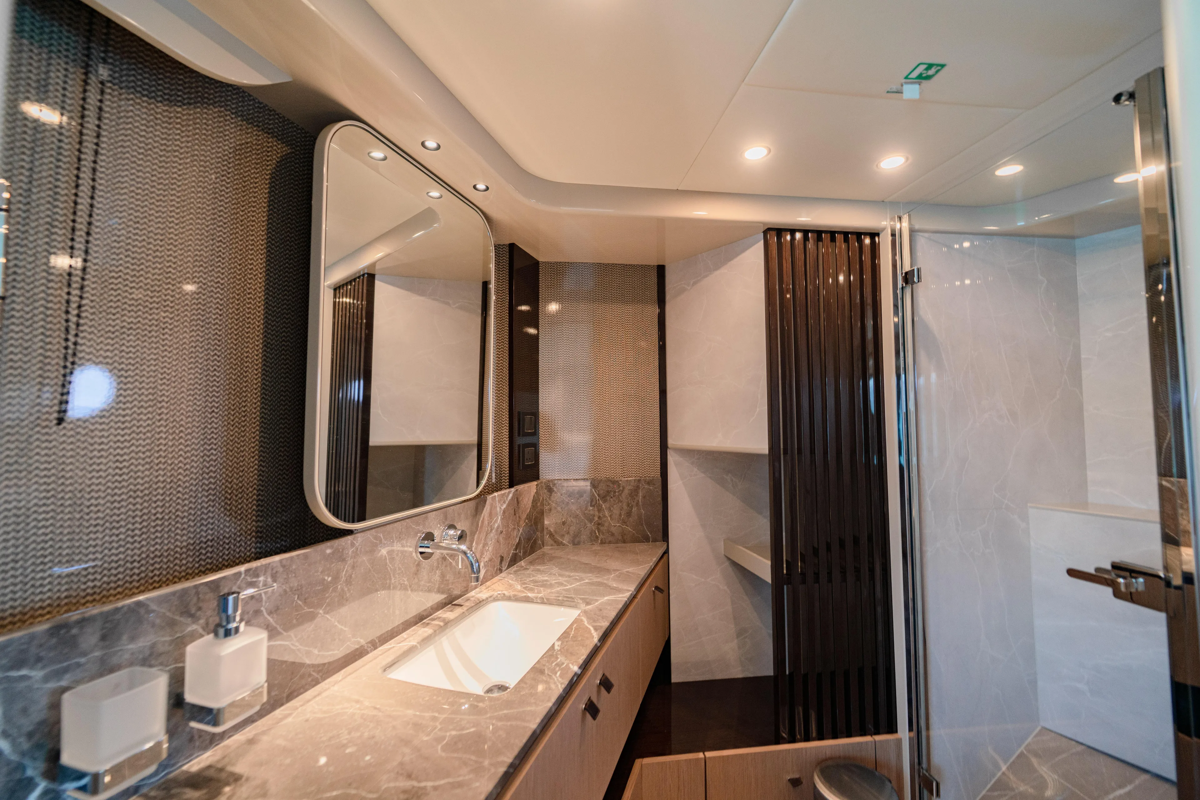  Yacht Photos Pics Luxurious bathroom interior of 2022 Absolute 56 FLY yacht with modern fixtures and marble accents.