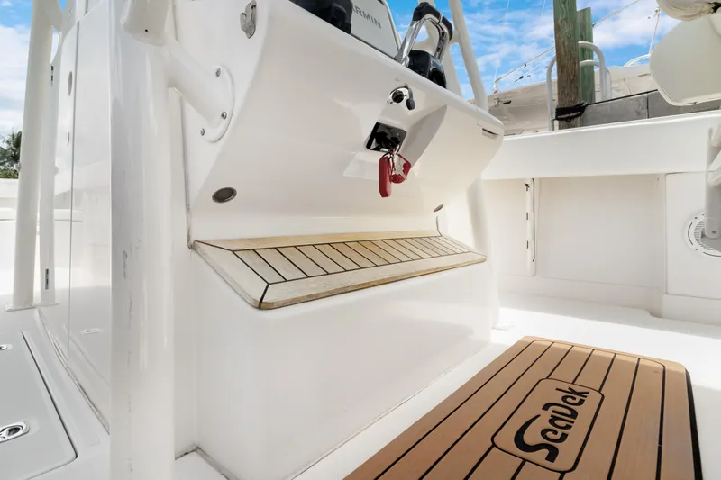 Da Blue Eagle Yacht Photos Pics 2011 Jupiter 38 boat interior with teak flooring and white console.