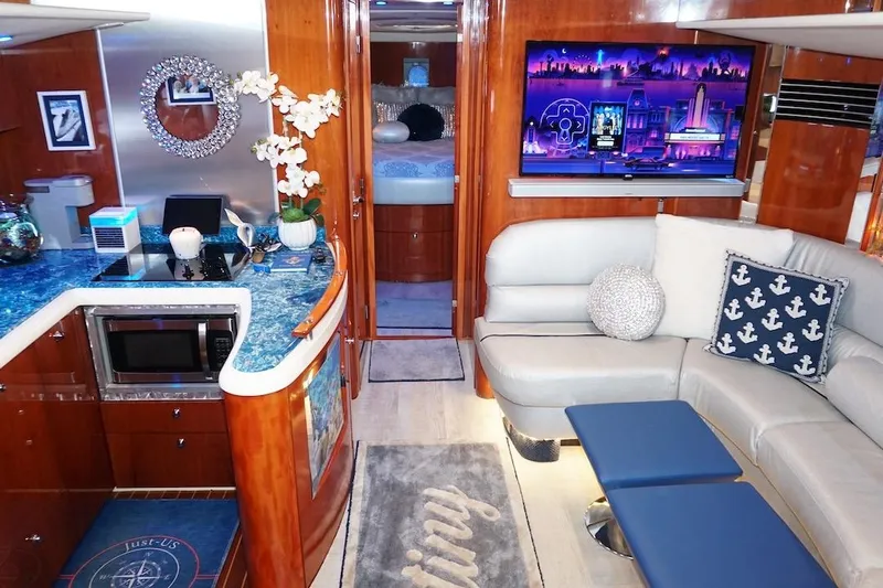  Yacht Photos Pics Luxurious interior of 2009 Fairline 52 Targa yacht with modern decor and entertainment system.
