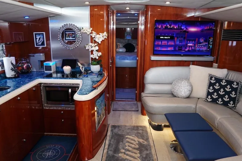  Yacht Photos Pics Luxurious interior of 2009 Fairline 52 Targa yacht with modern decor and entertainment system.