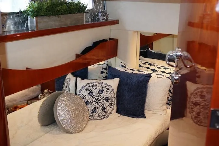  Yacht Photos Pics Luxurious cabin interior of 2009 Fairline 52 Targa yacht with elegant bedding and decor.