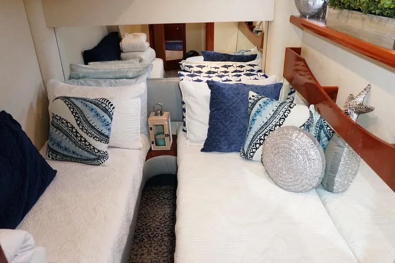  Yacht Photos Pics Luxurious cabin interior of 2009 Fairline 52 Targa yacht with decorative pillows and elegant decor.