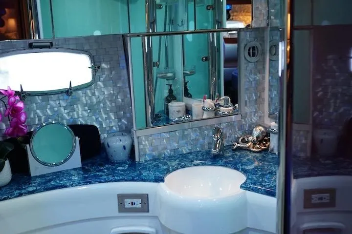  Yacht Photos Pics Luxurious bathroom interior of 2009 Fairline 52 Targa yacht with elegant blue countertop.
