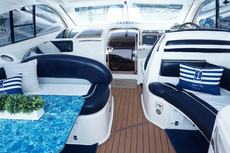  Yacht Photos Pics Luxurious interior of 2009 Fairline 52 Targa yacht with elegant seating and nautical decor.