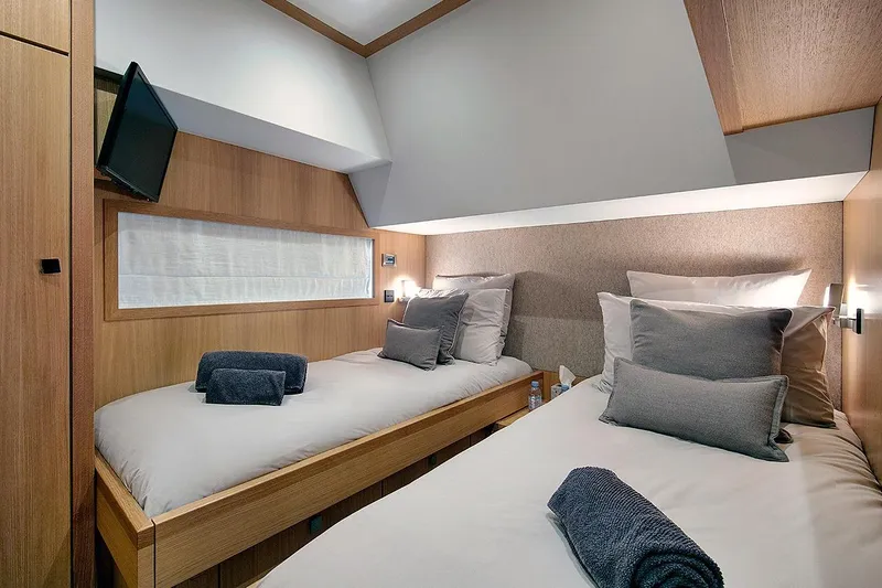 Armonee Yacht Photos Pics Luxurious twin cabin interior on 2017 Couach 2300 Fly yacht, featuring modern design and amenities.