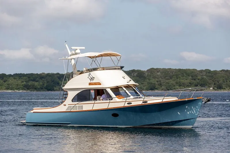 Paddy Wagon Yacht Photos Pics 2017 Hinckley Talaria 43 Flybridge yacht cruising on calm waters.