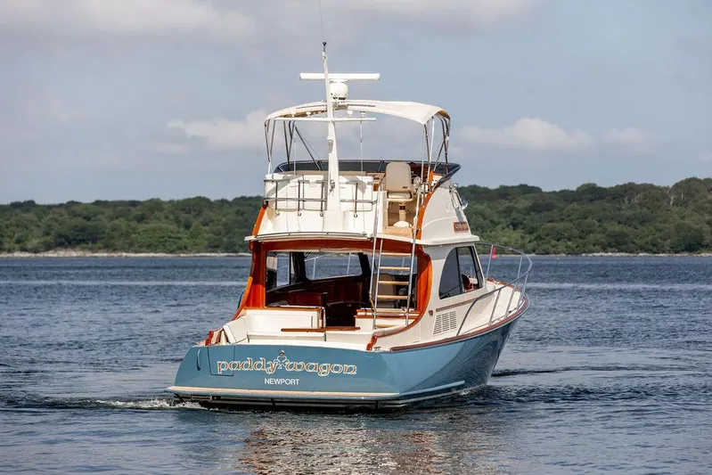 Paddy Wagon Yacht Photos Pics 2017 Hinckley Talaria 43 Flybridge yacht cruising on calm waters.