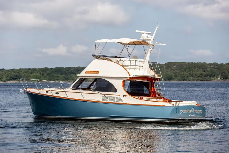 Paddy Wagon Yacht Photos Pics 2017 Hinckley Talaria 43 Flybridge yacht cruising on calm waters.