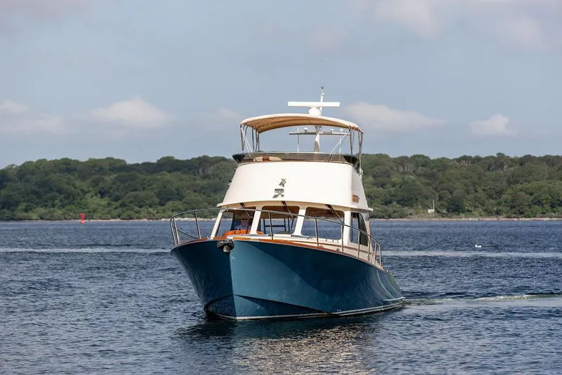 Paddy Wagon Yacht Photos Pics 2017 Hinckley Talaria 43 Flybridge yacht cruising on calm waters.