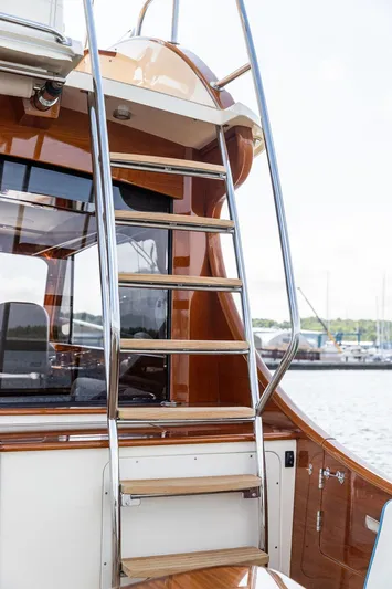 Paddy Wagon Yacht Photos Pics Hinckley Talaria 43 Flybridge 2017 yacht ladder with polished wood and metal finish.