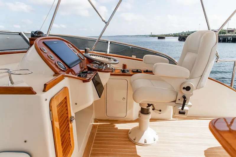 Paddy Wagon Yacht Photos Pics Helm of 2017 Hinckley Talaria 43 Flybridge with luxurious seating and controls.