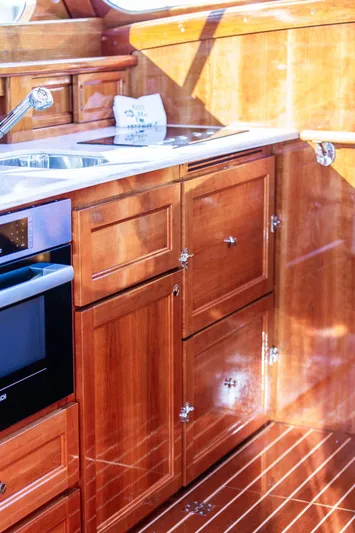 Paddy Wagon Yacht Photos Pics Luxurious wooden kitchen interior of 2017 Hinckley Talaria 43 Flybridge yacht.