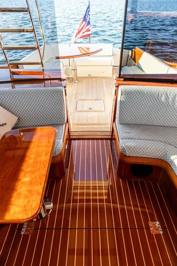 Paddy Wagon Yacht Photos Pics Luxurious 2017 Hinckley Talaria 43 Flybridge interior with polished wood and elegant seating.