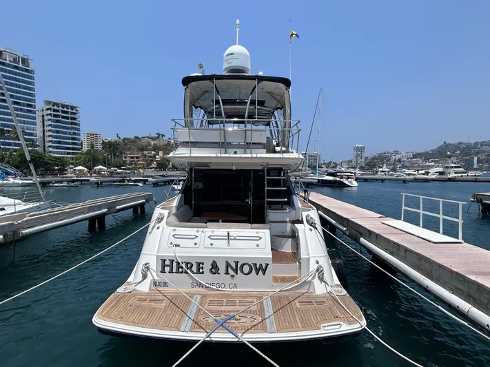 Here & Now 2017 Sea Ray 510 Fly @ Acapulco Yacht Photos Pics 2017 Sea Ray Fly 510 yacht docked in a marina, sunny day, cityscape background.