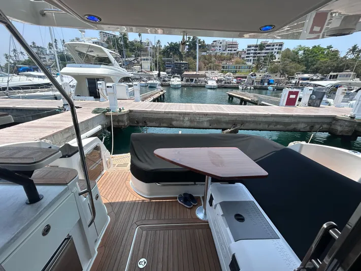Here & Now 2017 Sea Ray 510 Fly @ Acapulco Yacht Photos Pics 2017 Sea Ray Fly 510 yacht docked at a marina with seating area.