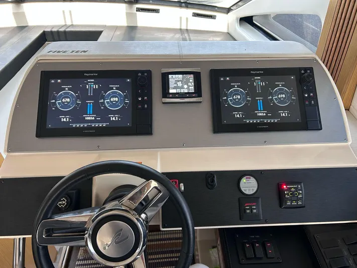 Here & Now 2017 Sea Ray 510 Fly @ Acapulco Yacht Photos Pics 2017 Sea Ray Fly 510 helm with dual navigation screens and steering wheel.