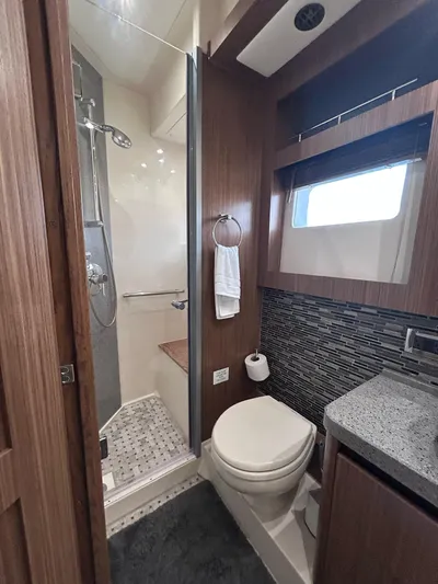 Here & Now 2017 Sea Ray 510 Fly @ Acapulco Yacht Photos Pics Luxurious bathroom in 2017 Sea Ray Fly 510 yacht with modern shower and elegant fixtures.