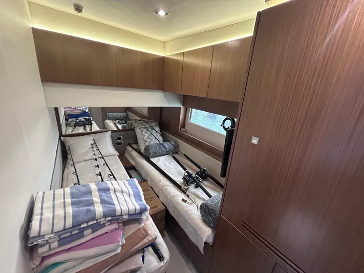 Here & Now 2017 Sea Ray 510 Fly @ Acapulco Yacht Photos Pics 2017 Sea Ray Fly 510 cabin interior with twin beds and wooden cabinetry.