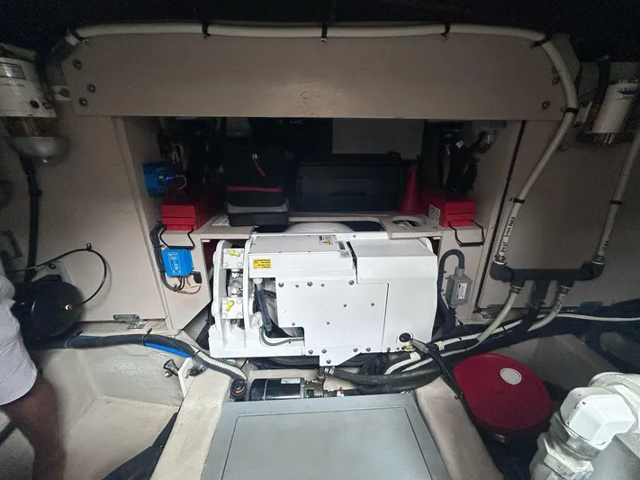 Here & Now 2017 Sea Ray 510 Fly @ Acapulco Yacht Photos Pics Engine room of 2017 Sea Ray Fly 510 yacht, showcasing mechanical components and wiring.
