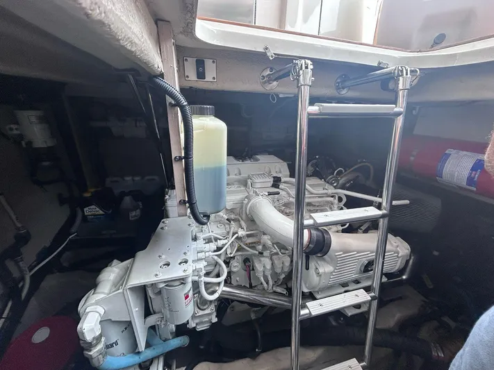 Here & Now 2017 Sea Ray 510 Fly @ Acapulco Yacht Photos Pics Engine room of 2017 Sea Ray Fly 510 yacht, featuring a visible engine and ladder.