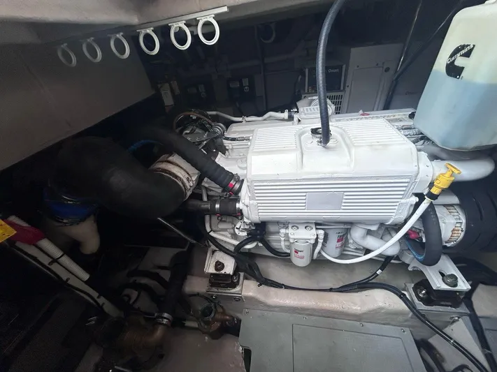 Here & Now 2017 Sea Ray 510 Fly @ Acapulco Yacht Photos Pics Engine compartment of a 2017 Sea Ray Fly 510 yacht, showcasing mechanical components.