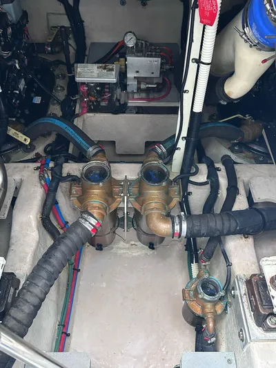 Here & Now 2017 Sea Ray 510 Fly @ Acapulco Yacht Photos Pics Engine compartment of a 2017 Sea Ray Fly 510 with visible hoses and components.