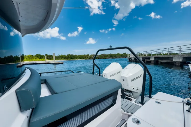 Yacht Photos Pics 2022 Axopar 28 Cabin BRABUS Trim boat with Mercury engines on a sunny day.