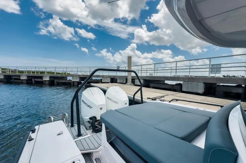  Yacht Photos Pics 2022 Axopar 28 Cabin BRABUS Trim boat docked, featuring dual Mercury engines.