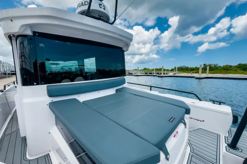  Yacht Photos Pics 2022 Axopar 28 Cabin BRABUS Trim boat docked by the water.