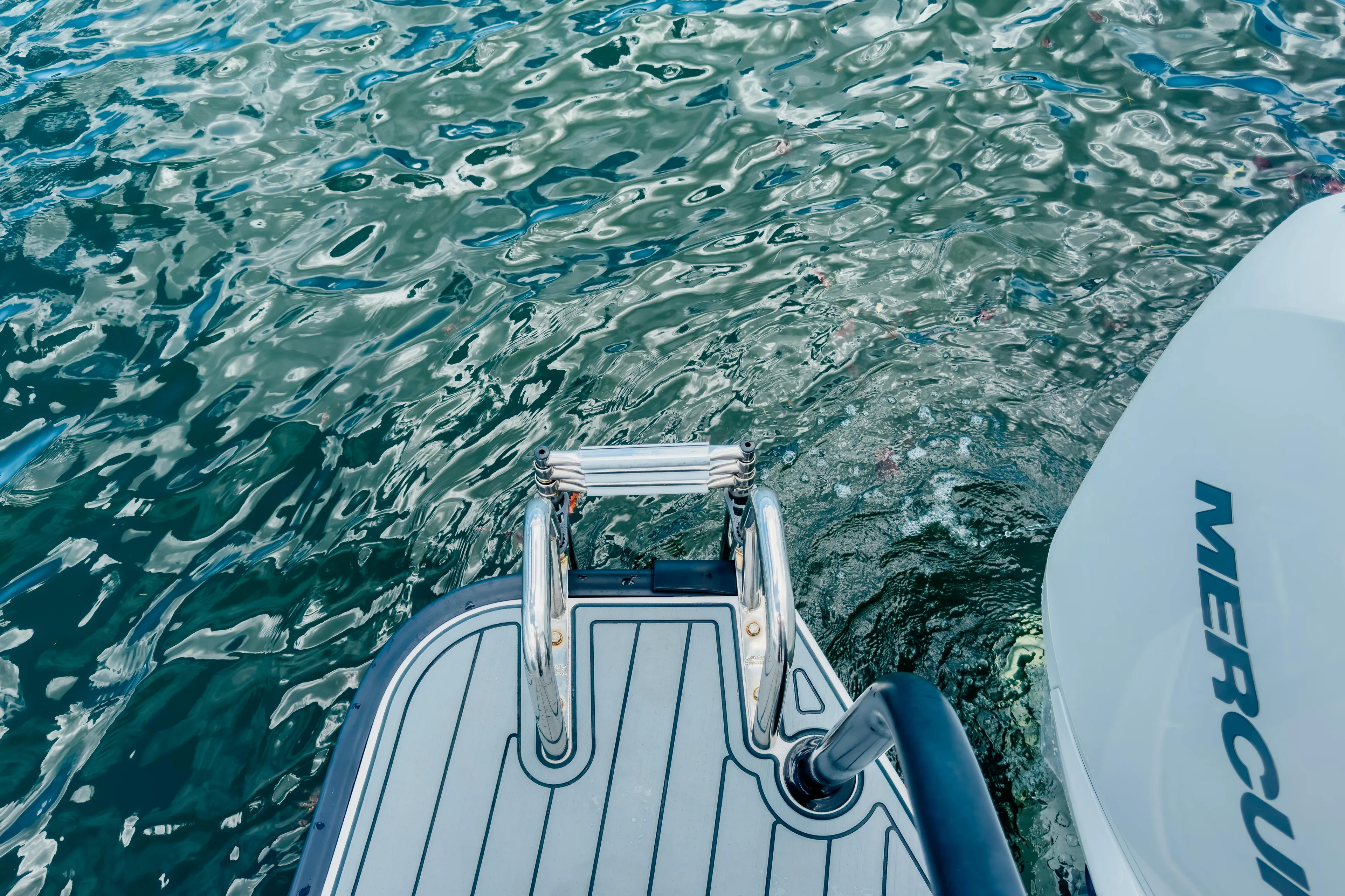  Yacht Photos Pics Axopar 28 Cabin BRABUS Trim 2022 boat with Mercury engine on water.