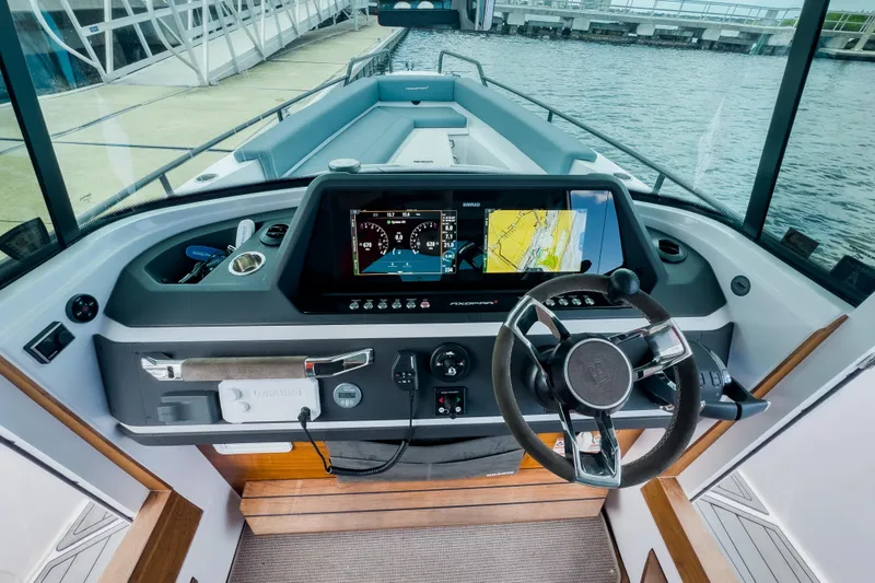  Yacht Photos Pics 2022 Axopar 28 Cabin BRABUS Trim helm with advanced navigation system and sleek design.