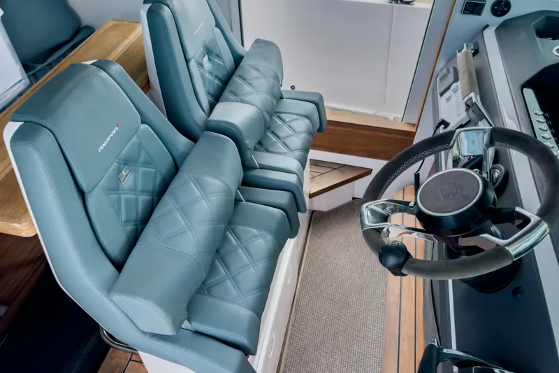  Yacht Photos Pics 2022 Axopar 28 Cabin BRABUS Trim interior with luxury seating and steering wheel.