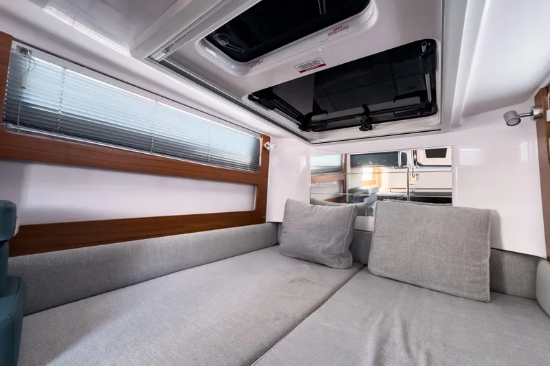  Yacht Photos Pics 2022 Axopar 28 Cabin BRABUS Trim interior with modern seating and sleek design.