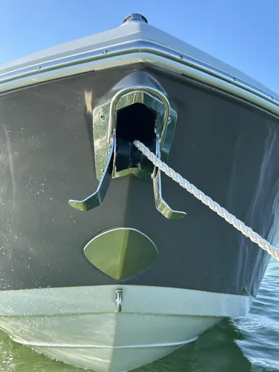  Yacht Photos Pics 2024 Crownline 260DC boat bow with anchor and rope in water.