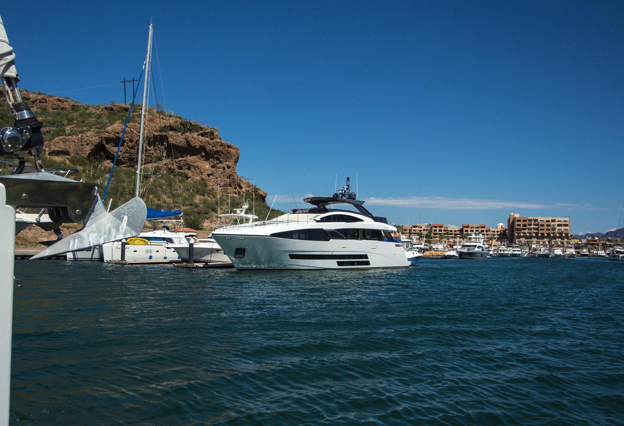 Luxury Bugari F86 yacht docked in a marina, 2021 model.
