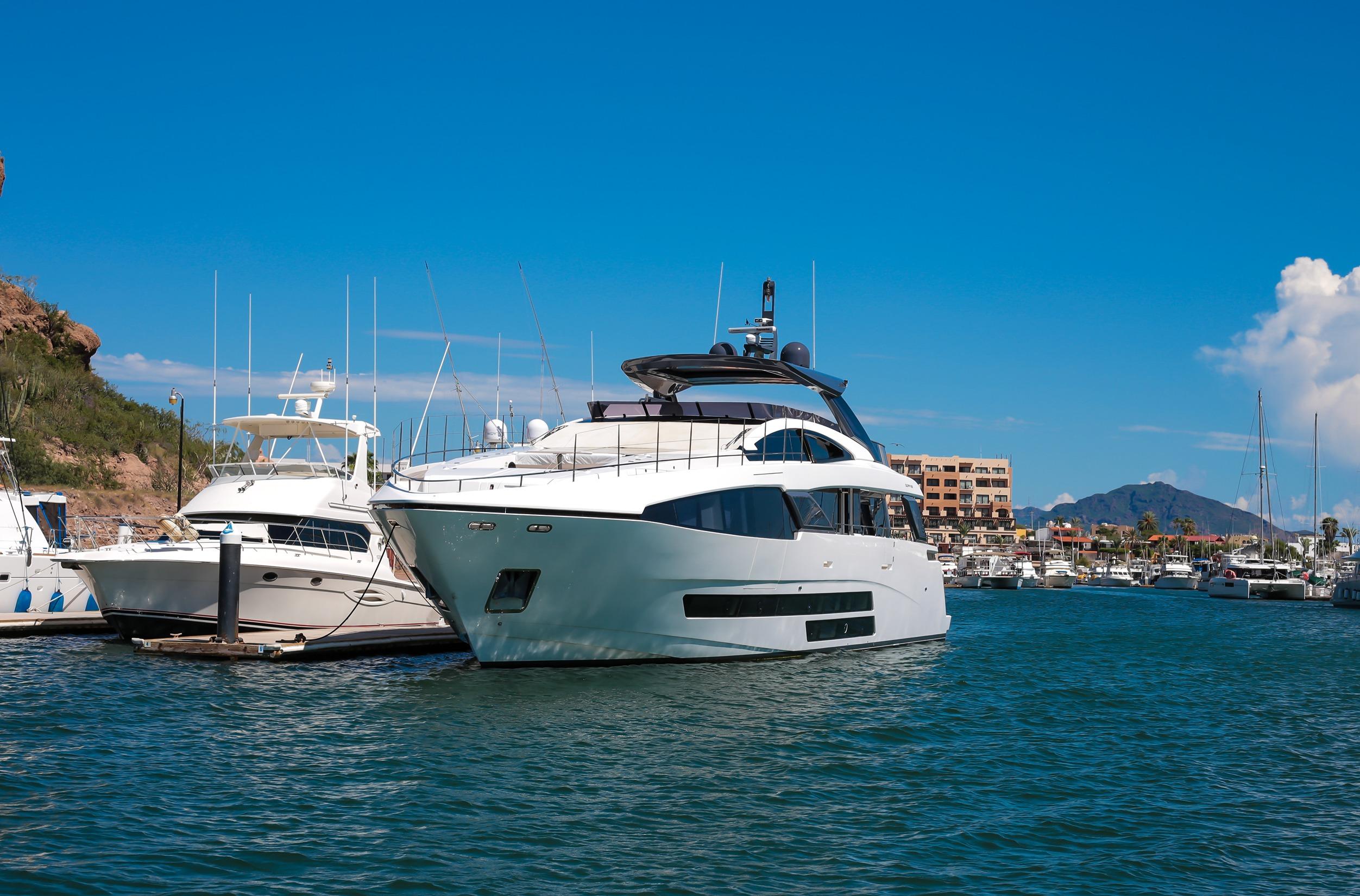 Luxury Bugari F86 yacht docked in marina, 2021 model.