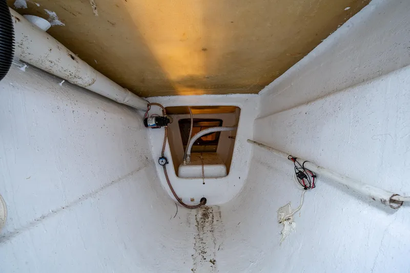  Yacht Photos Pics Interior view of 2019 Aventura 31 Cat boat, showing pipes and wiring.