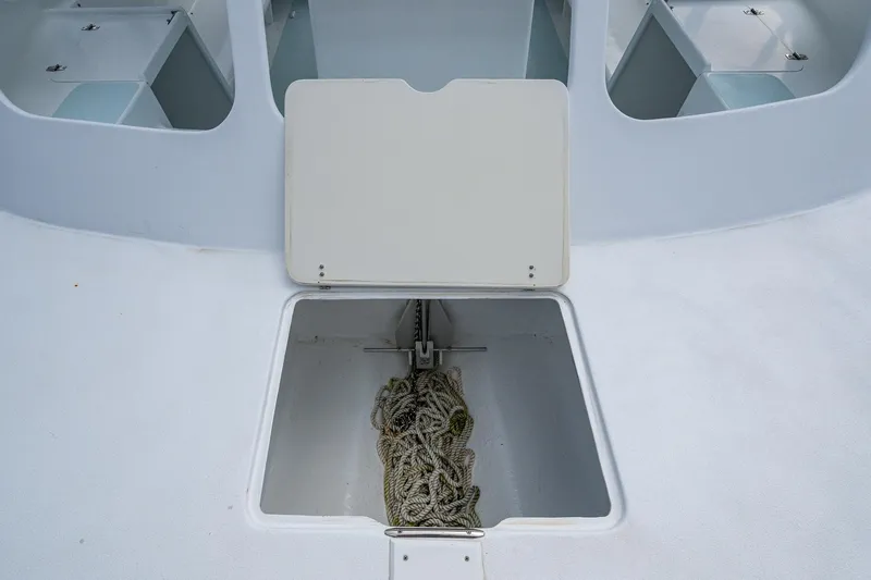  Yacht Photos Pics Anchor storage compartment on 2019 Aventura 31 Cat boat with rope inside.