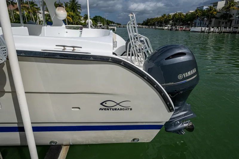  Yacht Photos Pics 2019 Aventura 31 Cat boat with Yamaha engine docked on a sunny day.