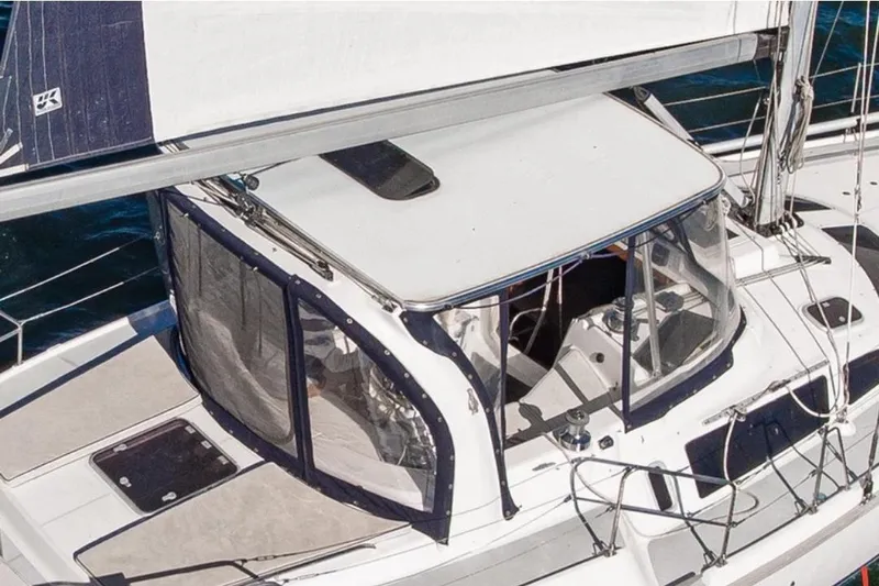  Yacht Photos Pics 1999 Hunter Passage 420 sailboat cockpit with protective canopy and sleek design.