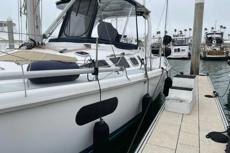  Yacht Photos Pics 1999 Hunter Passage 420 sailboat docked at marina with fenders and step ladder.